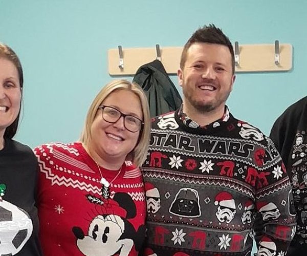 Members-of-Utopia's-Customer-Support-Team-sporting-their-festive-jumpers